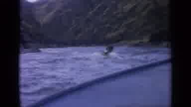Idaho USA (1963): Boat And Jetski Cruising In Mountainside Lake With Clear Skies