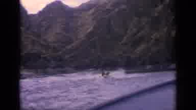 Idaho USA (1963): Speed Boat Splashing Making Waves In Lake Surrounded By Tall