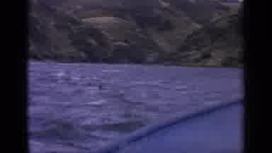 Idaho USA (1963): View Of Green Mountains And Blue Lake Water On A Clear Day