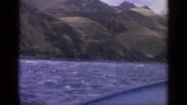 Idaho USA (1963): Boat On A Shaking River In Front Of A Tall Green Mountain With