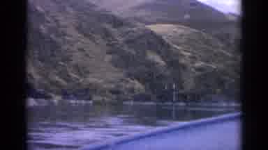 Idaho USA (1963): Beautiful Shot Of Lake And Mountains With Trees Nearby