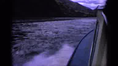 Idaho USA (1963): Fast Blue Boat Speeding On The Water Creating Wakes