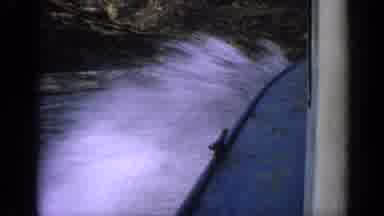 Idaho USA (1963): Boat Sailing Quickly On The Splashing Water On The Shore