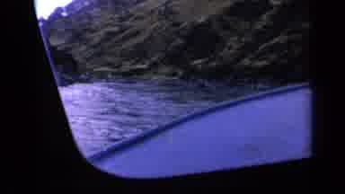 Washington USA (1963): Vessel Sailing Through A River Valley Near Shore And Tall