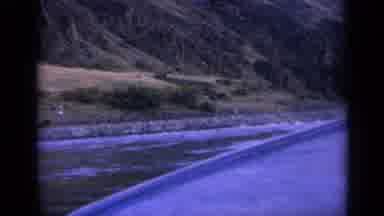 Washington USA (1963): A Boat Rows Towards A Shore Where Small Dainty White Caps