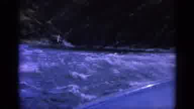 Washington USA (1963): A Person Goes Boating Through Rapids In A River At Dark