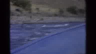 Washington USA (1963): View From A Boat That Is Travelling Along A River