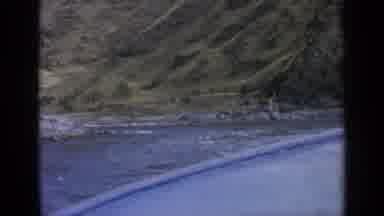 Washington USA (1963): Boat Ride In Rippling Water Along Rocky Shore Near