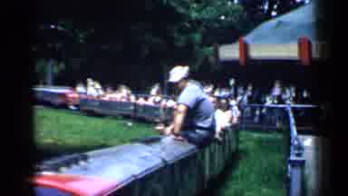 Chicago Illinois (1957): Adults And Kids Ride Train And Carousel At Amusement Park