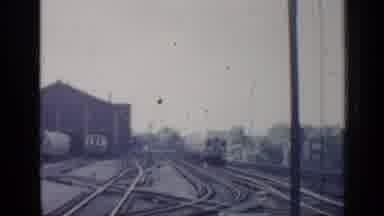 Chicago Illinois (1958): A Commuter Train With Two Cars Comes Forward Then Goes