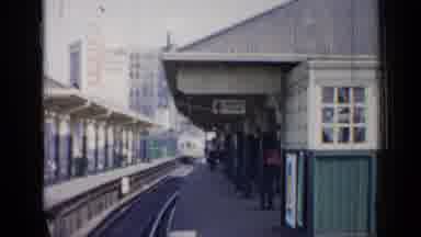 Chicago Illinois (1958): Commuter Vehicle Enters Station Then Moves On Passing