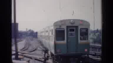Chicago Illinois (1958): Old Film Of Train Running Along Track Then Cuts To City