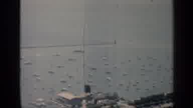 Chicago Illinois (1958): View Of White Objects Lined Up In Water On A Clear Day