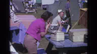 Colorado USA (1959): Woman Does Her Makeup Outdoors In A Park