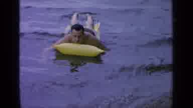 Greenwood Lake New York (1964): Man Floating On Calm Water In A Lake By Laying On