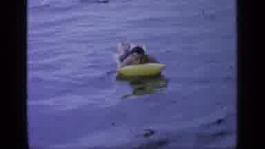Greenwood Lake New York (1964): Man Floating On An Inflatable Raft In A Body Of