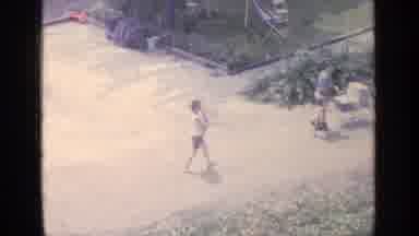 Greenwood Lake New York (1964): Person Wearing Blue Shirt Pushes Blue Baby