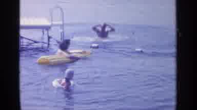 Greenwood Lake New York (1964): Man Operating A Yellow High Lift Using The Bucket