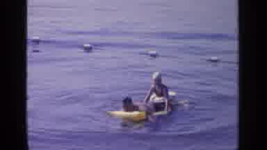 Greenwood Lake New York-1964: Man and Woman Playing on Inflatable Raft in Water