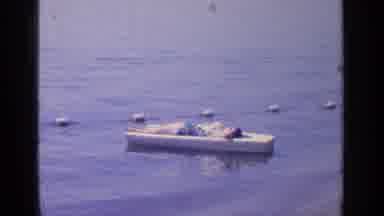 Greenwood Lake New York (1964): A Boy Relaxes On A Board As It Floats In The Water