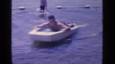 Greenwood Lake New York (1964): A Boy Propels Himself Through The Water On A