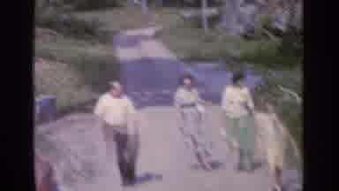 Greenwood Lake New York (1964): A Group Of People Walk Up The Driveway Of A House