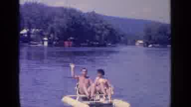 Greenwood Lake New York (1964): Man And Woman Ride On Yellow Paddleboat As Man