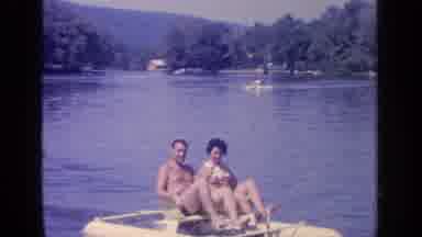 Greenwood Lake New York (1964): Couple Riding A Water Wheeler In Lake Having Fun