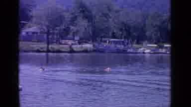Greenwood Lake New York (1964): Two People In A Small Boat Move Across Lake Near