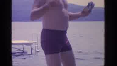 Greenwood Lake New York (1964): Man At Lake Raises His Hands Then Two Women In