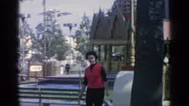 Flushing Meadows New York (1964): Lady In Red Top Walking Round A Church Courtyard