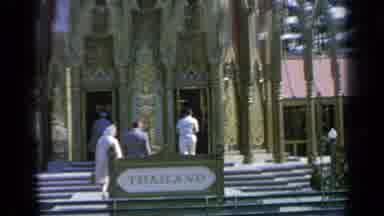 Flushing Meadows New York (1964): People Walking Up Steps To A Building With A