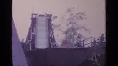 Flushing Meadows New York (1964): A Child Goes Down The Slide Of A Water Park In