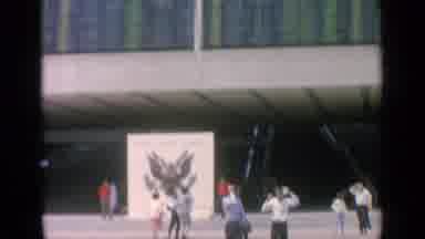 Flushing Meadows New York (1964): People Roaming Around Outside A Building Near A