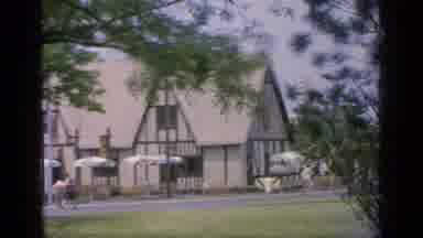Flushing Meadows New York (1964): Person White Shirt Dark Room Walking Forward