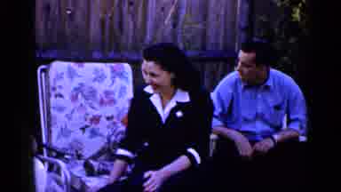Long Island New York (1965): Man In A Blue Shirt Wearing A Fireman's Hat Having A