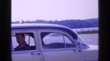 Long Island New York (1965): Four Passenger Cream Car With One Man In Car In