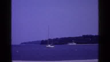 Long Island New York (1965): Boats In A Lake In The Distance With A Forest In The