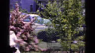 LONG ISLAND NEW YORK-1965: Man Sunbathes Outside His Residence In The Middle Of