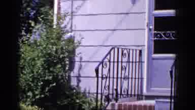 Long Island New York (1965): A Pan Of A Beautiful Grey House With Greenery Lights