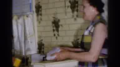 Long Island New York (1965): A Woman Tosses Dough To An Older Man While A Younger