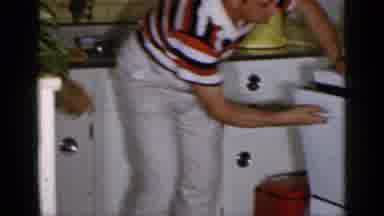 Long Island New York-1965: Man Drying Dishes In A Classic Kitchen