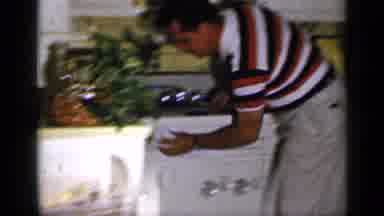 Long Island New York (1965): Man Wearing A Striped Shirt Using A Rag To Wipe Down