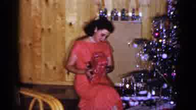 Long Island New York (1965): A Woman And Man Opening Presents During The Christmas