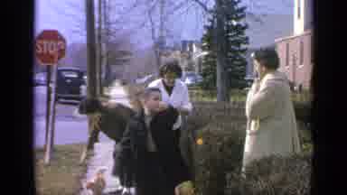 Long Island New York (1965): People On Big Sidewalk Going Together With Their Cat