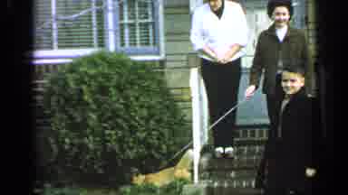 Long Island New York (1965): Lady Holds Dog On Tight Chain As Boy Walks Back And