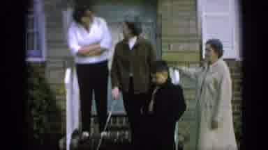 Long Island New York (1965): Four People Stand In Front Of Stone House On A Clear