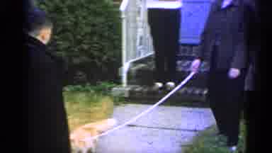 Long Island New York (1965): Person Walking Their Cat Outside Of Their House As