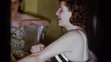Mineola New York (1966): Woman Talks And Washes Herself While Husband Struts