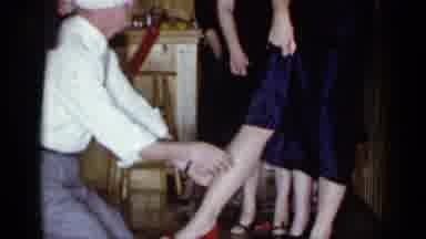 Mineola New York (1966): A Guy With A Blindfold On Is Feeling A Woman Leg Trying